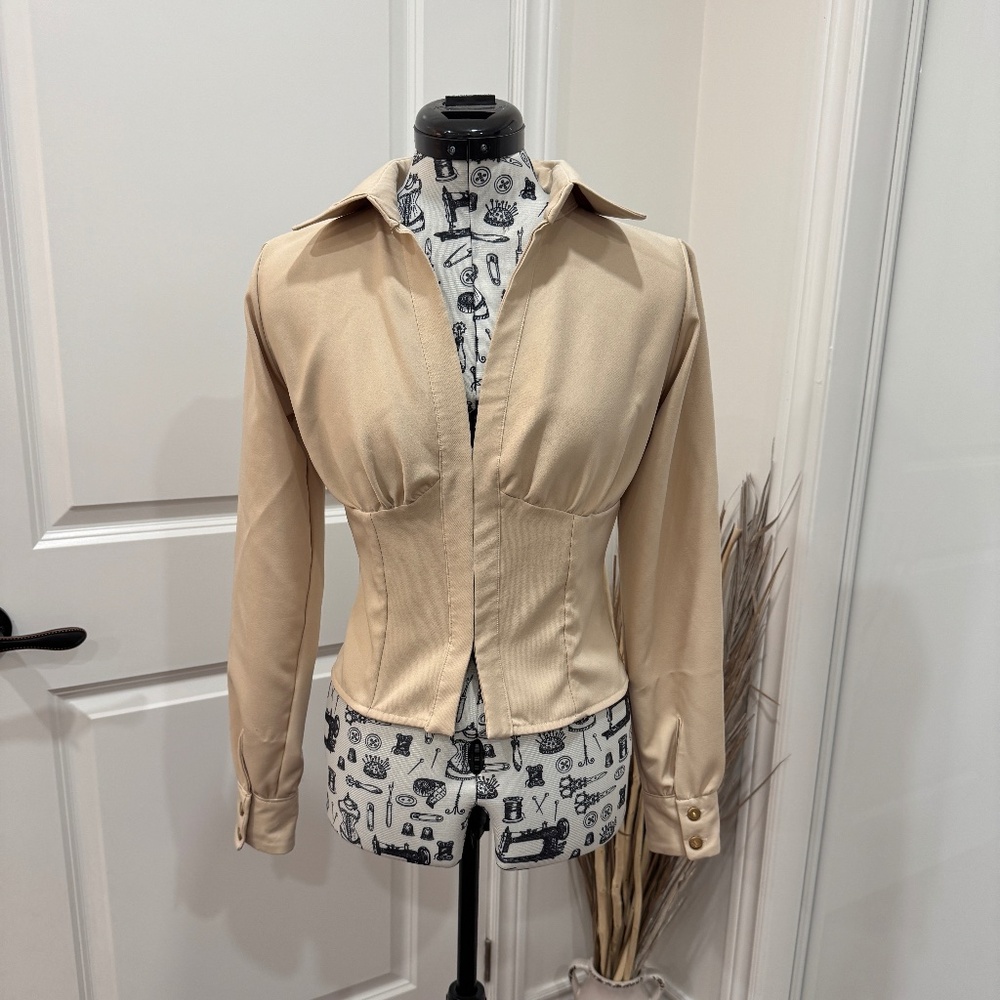 Cream Fitted Blouse with gold accents.